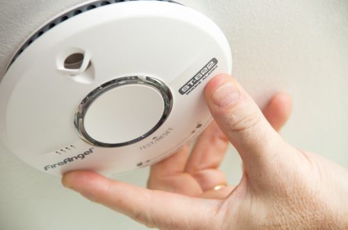 smoke alarm being fitted