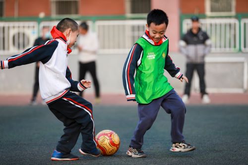 children playing football