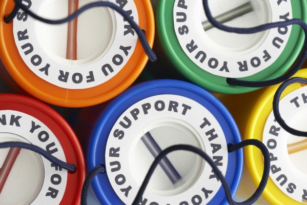 ariel view of fundraising tins in various colours