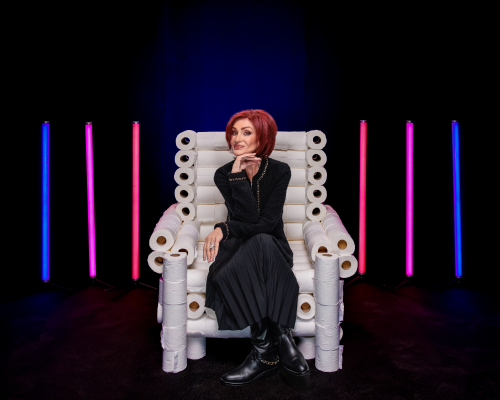 Image of Sharon Osborne sat on a chair made out of toilet rolls